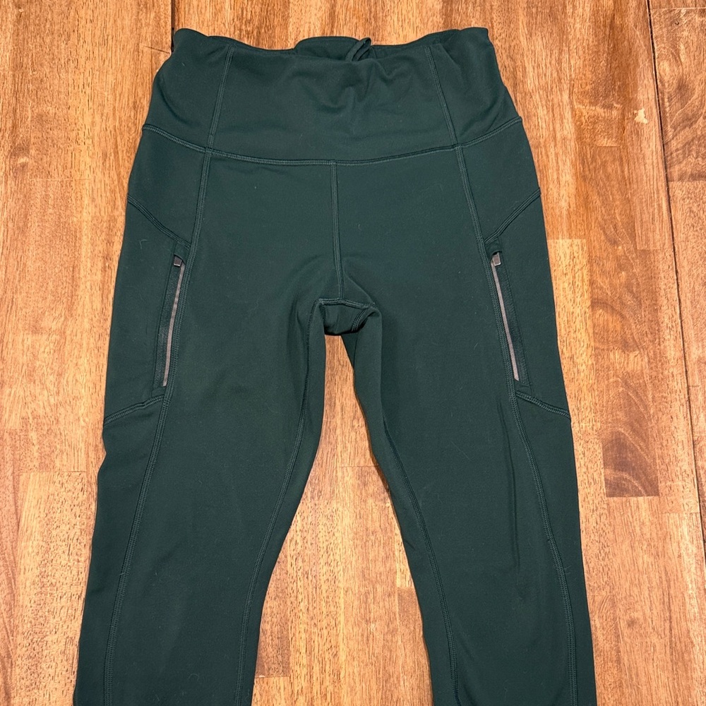 Athleta Forest Green High-Rise Leggings with Zippered Pockets